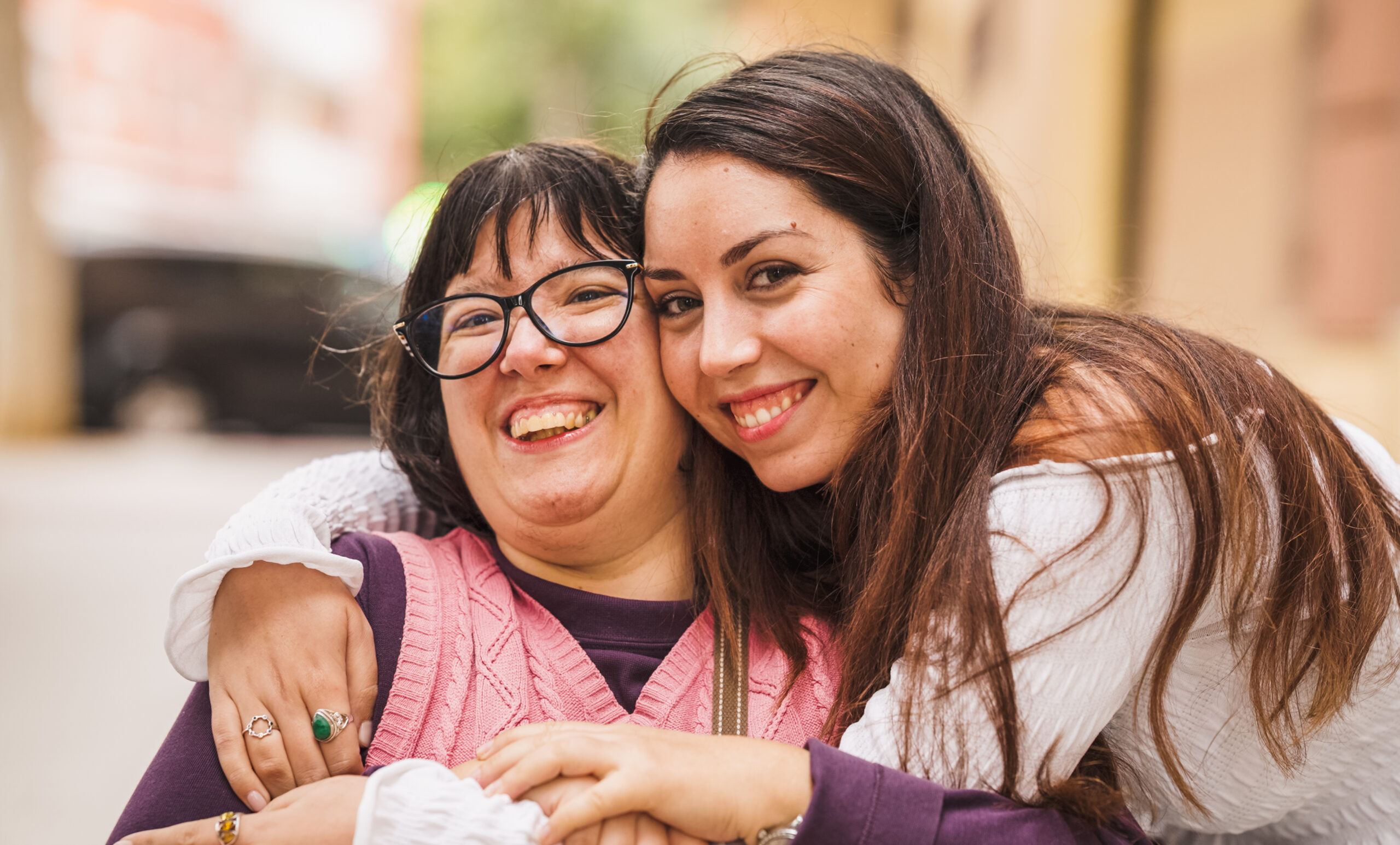 Two women smiling together outdoors