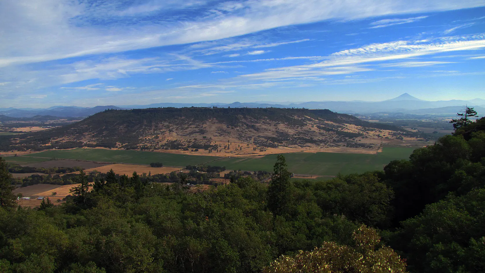 Upper Table Rock rising above the farmland of the Rogue Valley in Jackson County